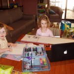 Hannah and Sarah drawing chicken pictures.